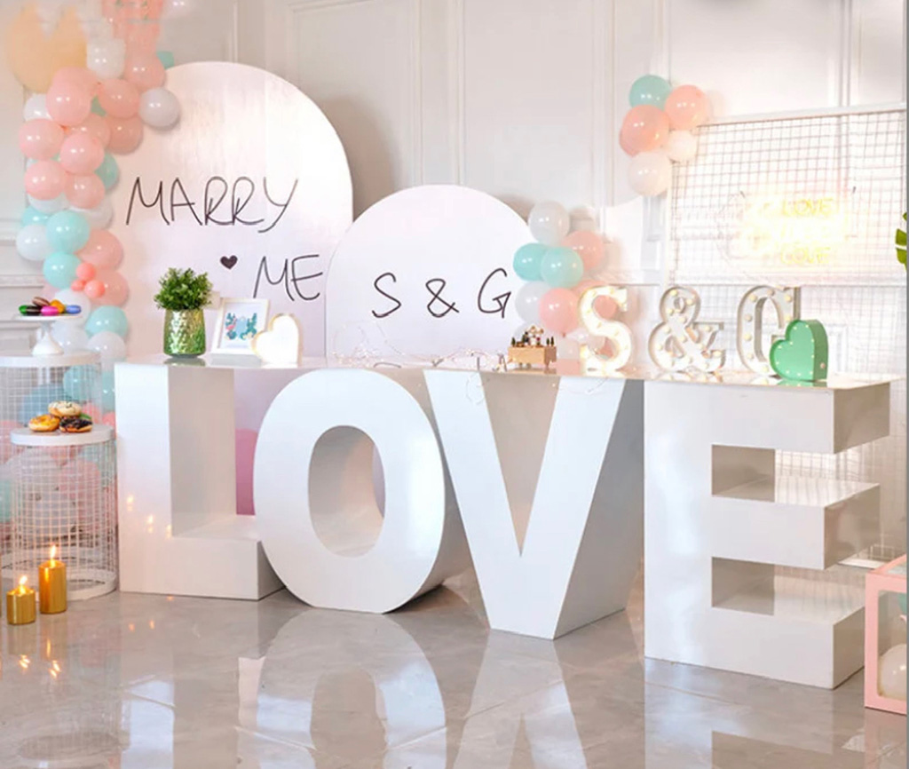 Love Letter Tables with marry me message at the back